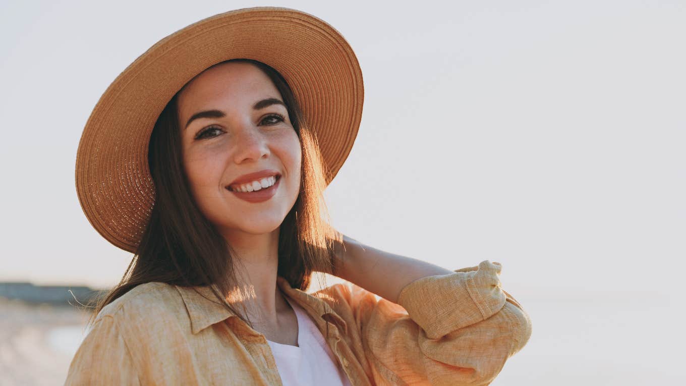 Tiny Ways To Be A Better Human Every Day happy smiling woman who is a good person