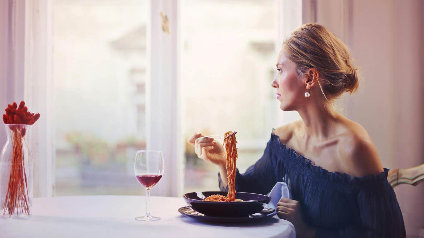 Woman Angers Her Date By Telling Him About Her '3 Year Rule' For Dating Before Marriage Woman eating pasta at table