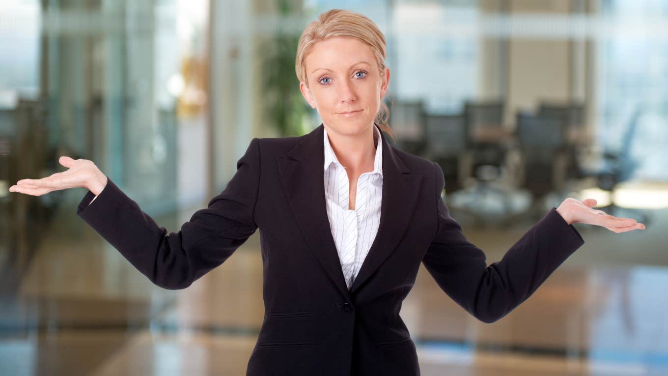 Woman Lied On Her Resume To Start Her Successful 15-Year Career woman shrugging about having lied on her resume