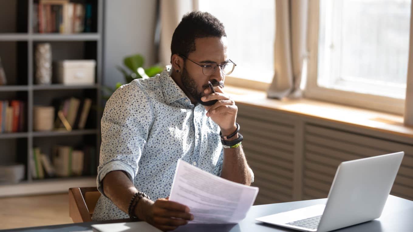 'High Performer Coach' Shares The 2 Signs You're Too Emotionally Attached To Your Job focused serious man working on computer in office