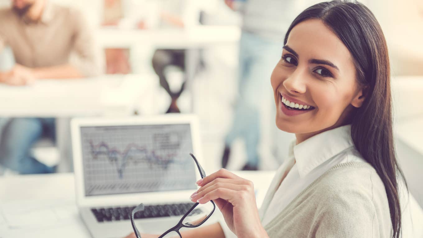 Gen Z Worker Says Workday Should End After Lunch Gen Z worker smiling while working