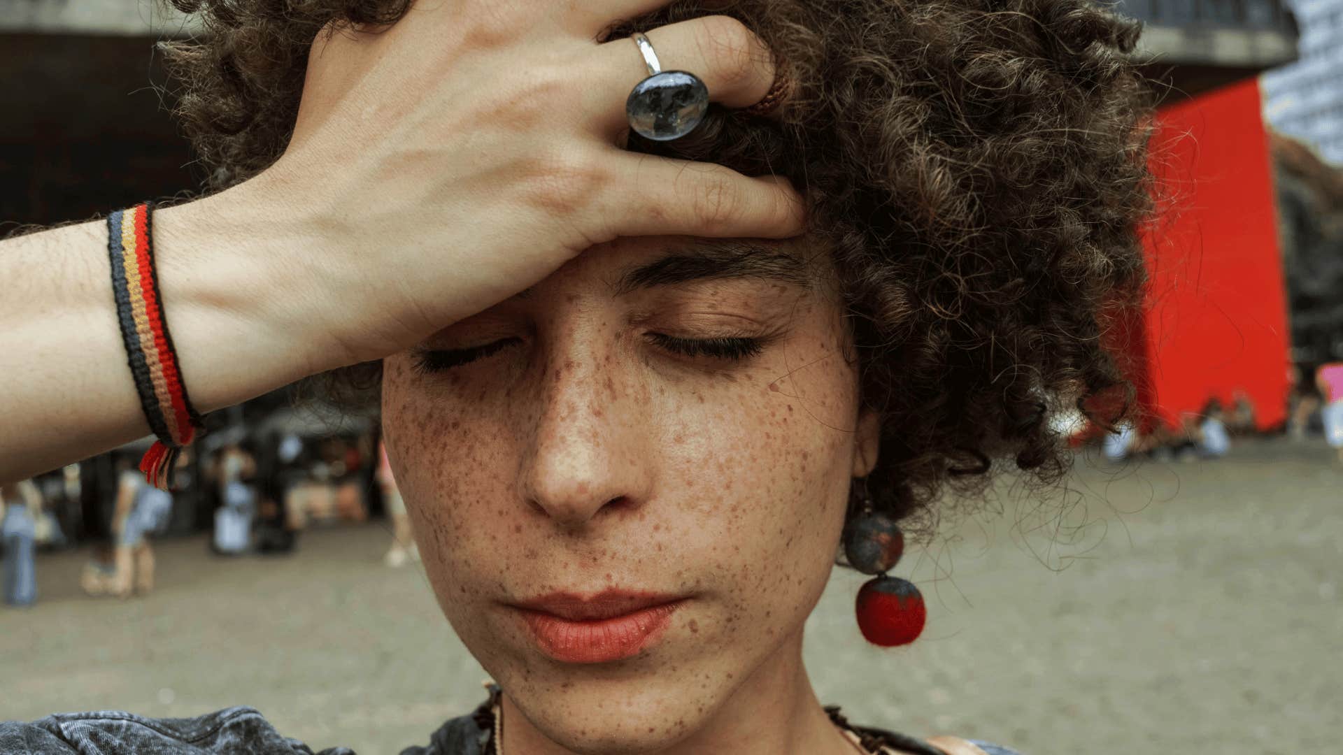 woman with her hand on her head