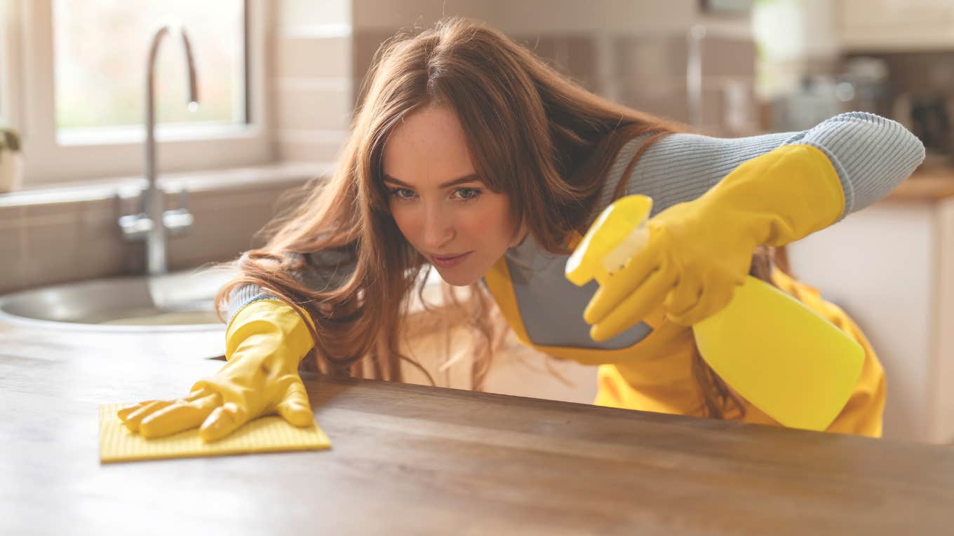House Cleaner Attacked By Customer's Wife Professional house cleaner disinfecting kitchen counters