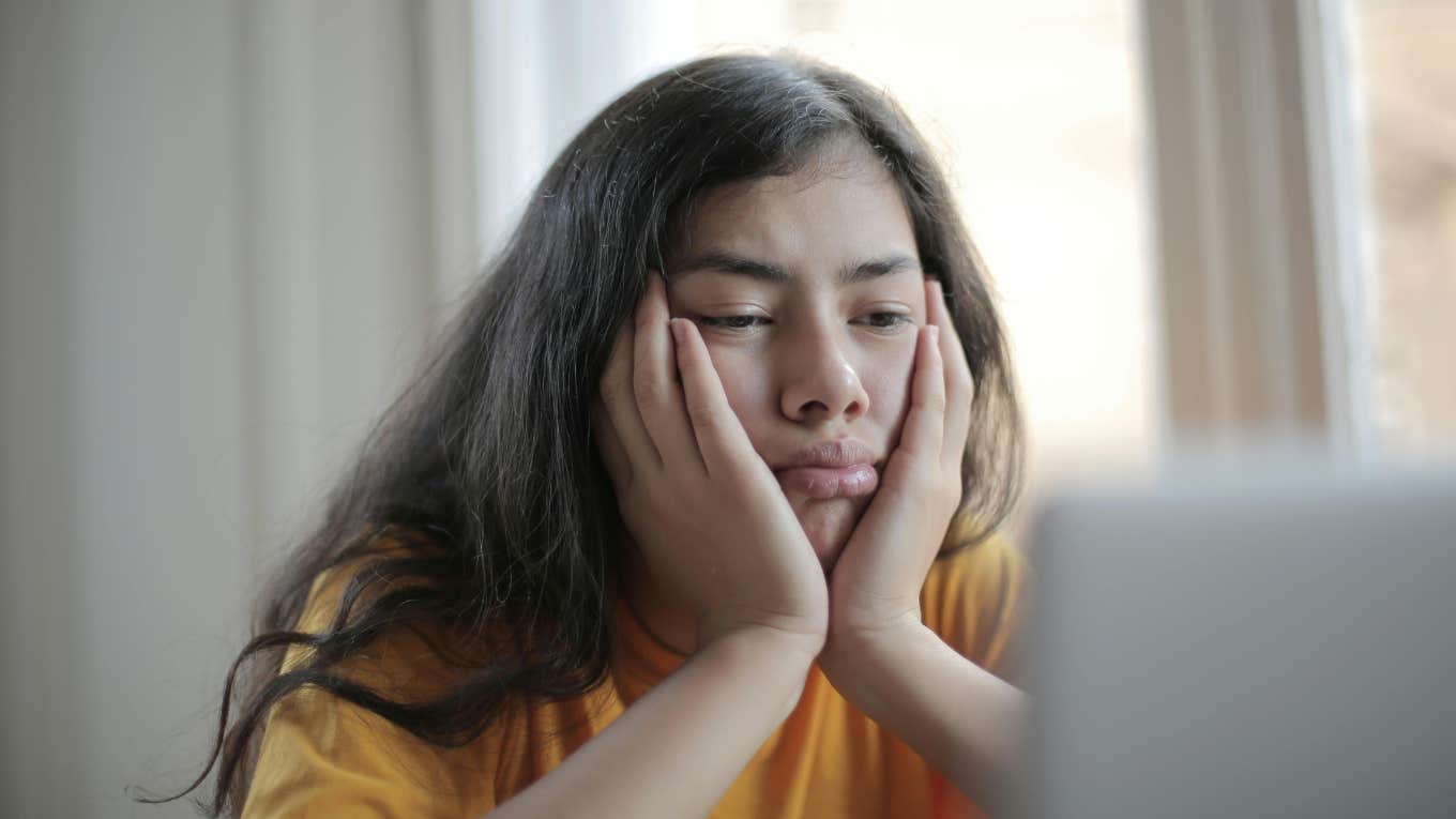 Dad Worries About His 'Brilliant But Lazy' Daughter's Future After His Ex Promises Her Money For College That Doesn't Exist Lazy daughter staring at laptop