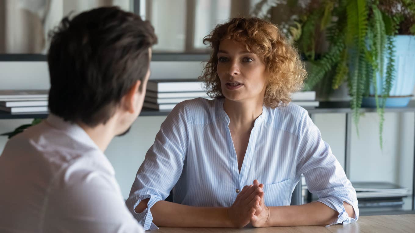 Manager Questions How To Address Smelly Employee Whose Odor Makes Coworkers Sick two businesspeople having conversation in office