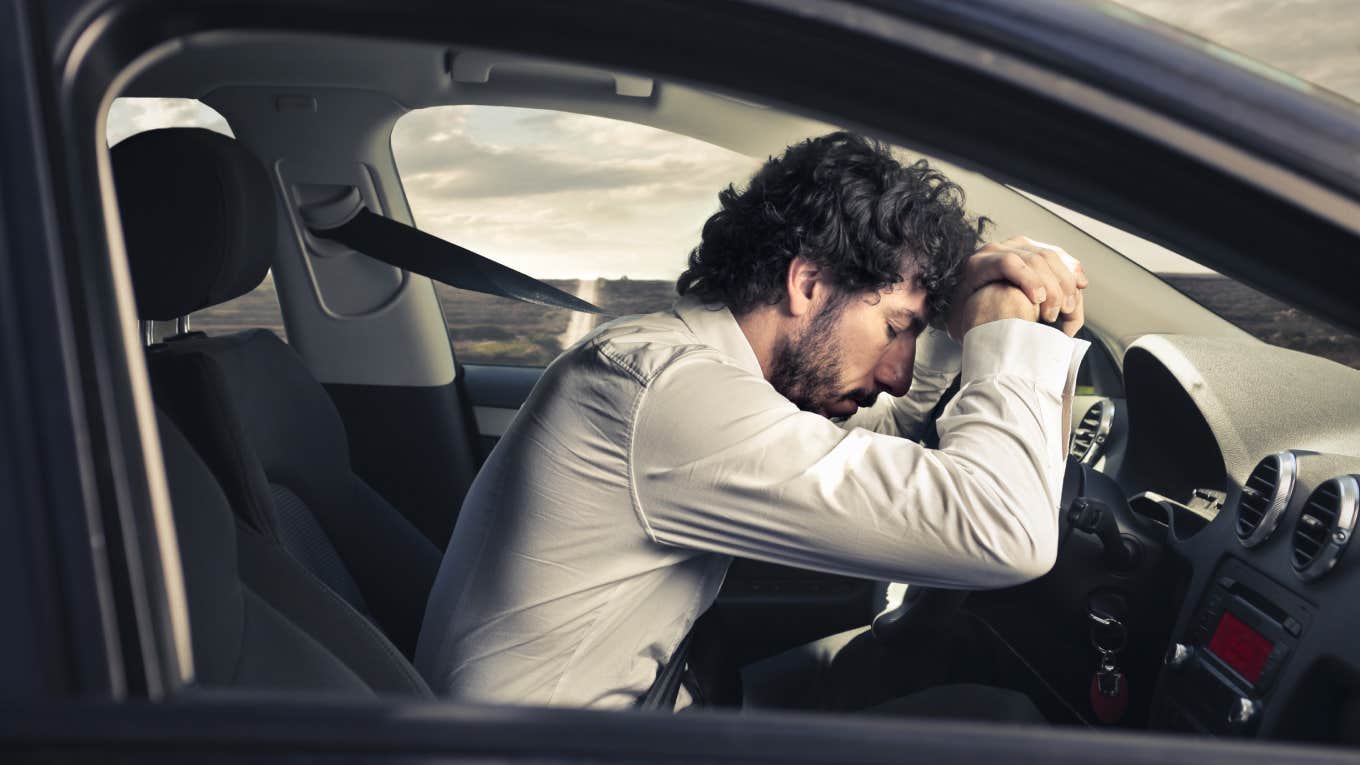 Millennial Lives In A Rental Prius Because He Can't Afford Rent Despite Working 50 Hours A Week man sleeping at the wheel in car