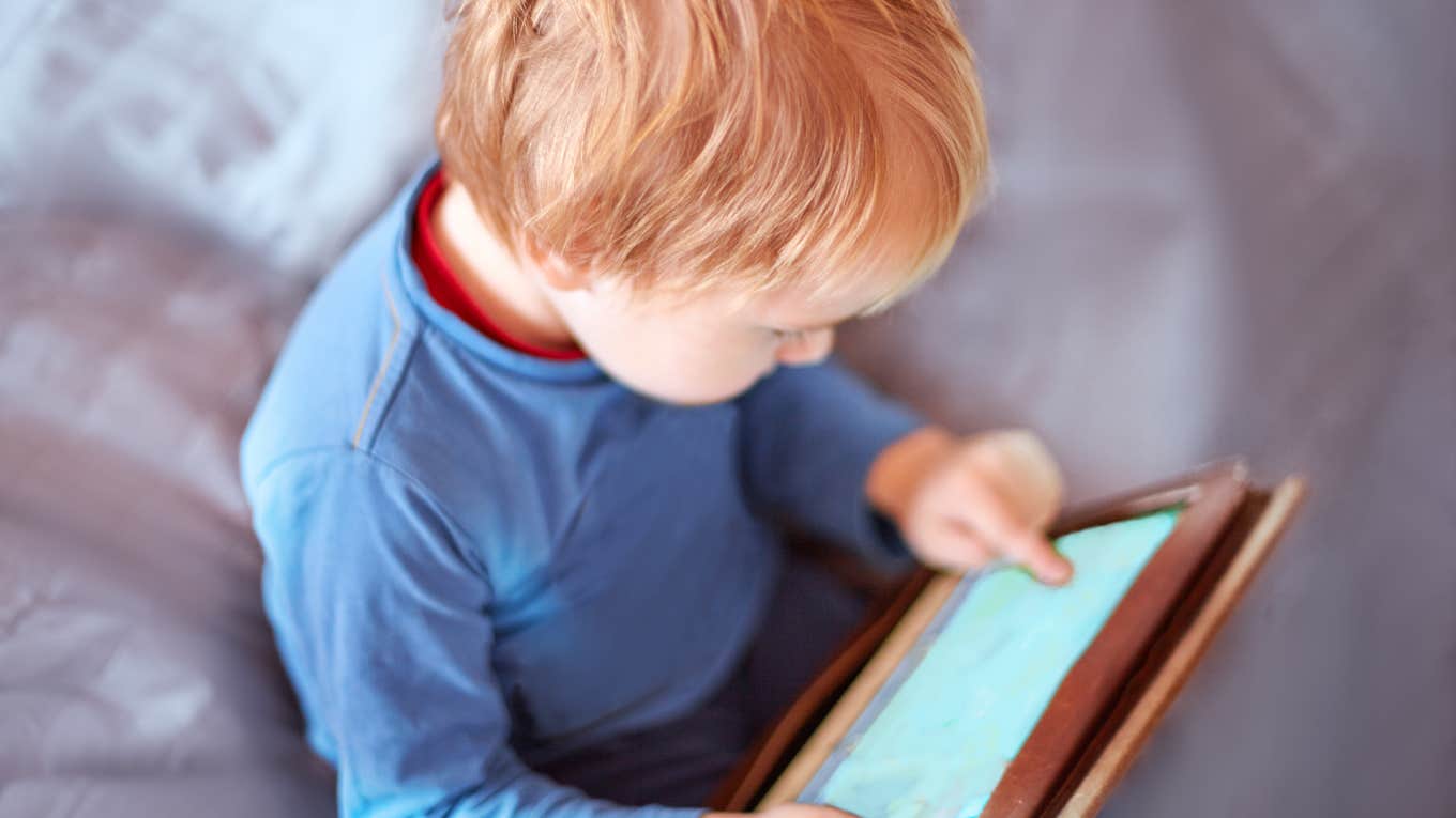 Mom Says She Regrets Letting Her Son Become An iPad Baby baby boy playing on tablet