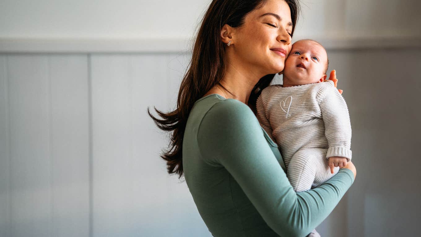 Mom Throws Surrogate Out After She Crossed Boundary mom holding her newborn baby