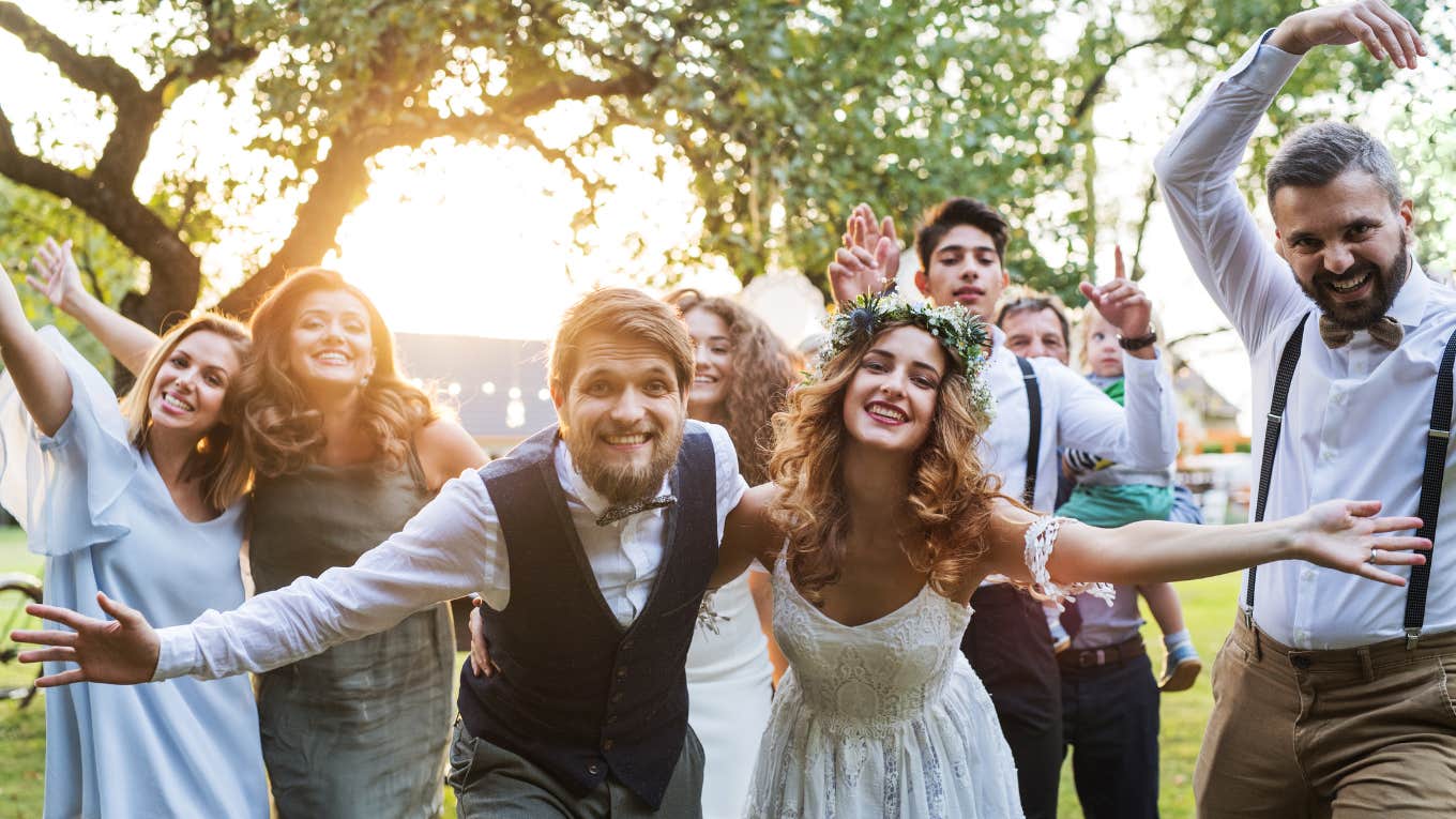 Newlyweds Accused Of Tacky Wedding For Serving Instant Ramen Bride and groom posed at reception with guests