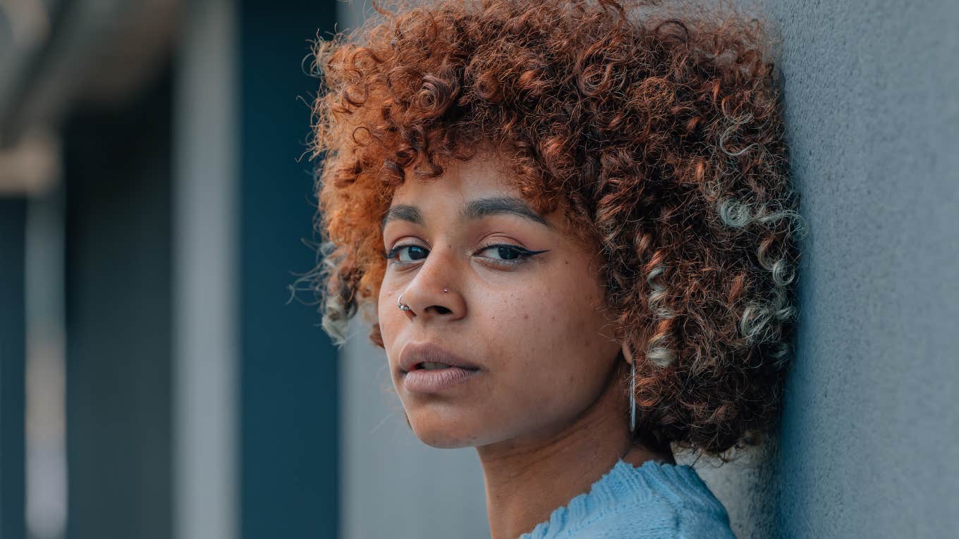 Signs Someone In Your Life Is Out To Get You, According To Psychology woman looking concerned