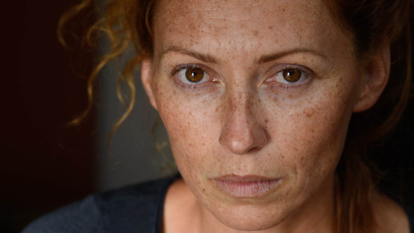 sullen woman who had a rough childhood