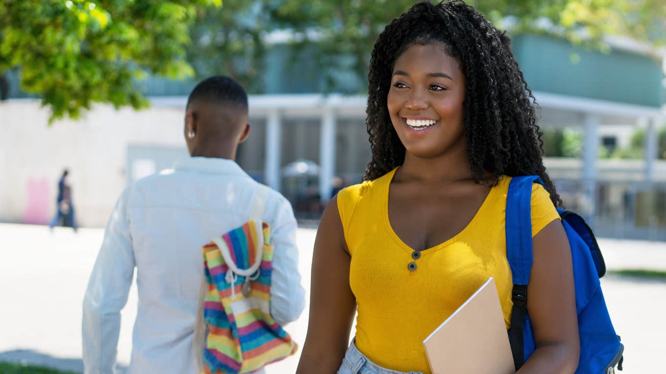 Student Accepted To Duke And USC Reveals Why She Chose A State University College student smiling while walking around campus