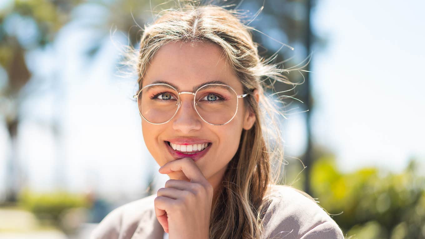 Tiny Tricks To Create An Insanely Unfair Advantage In Your Life woman with glasses smiling