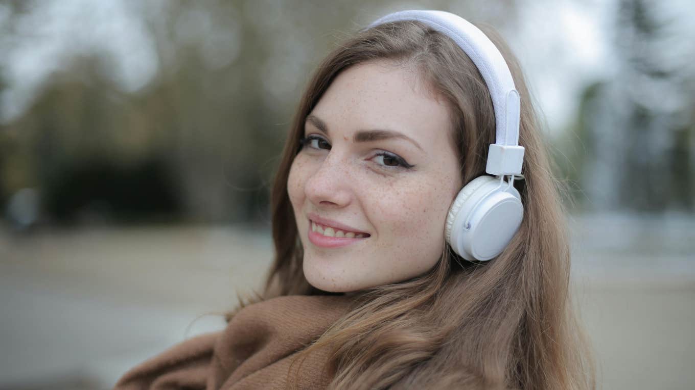 Woman Is Thankful She Has 'Ugly Privilege' Smiling woman alone with headphones