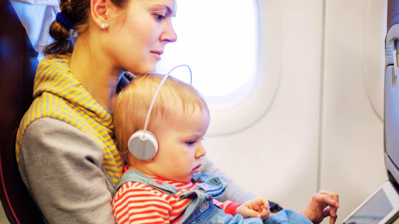 Gate Agents Reportedly Forced Mom To Take Her Infant Out Of A Car Seat On Her Flight Despite It Being Approved For Air Travel woman on plane with baby