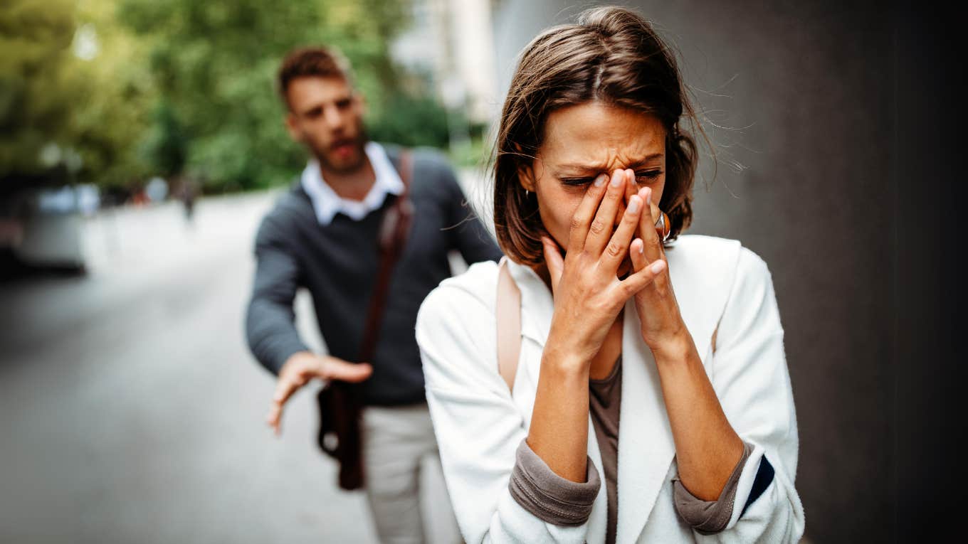 7 Heartbreaking Signs Your Fiancé Is Not The One, According To Psychology Heartbroken woman walking away from fiancé