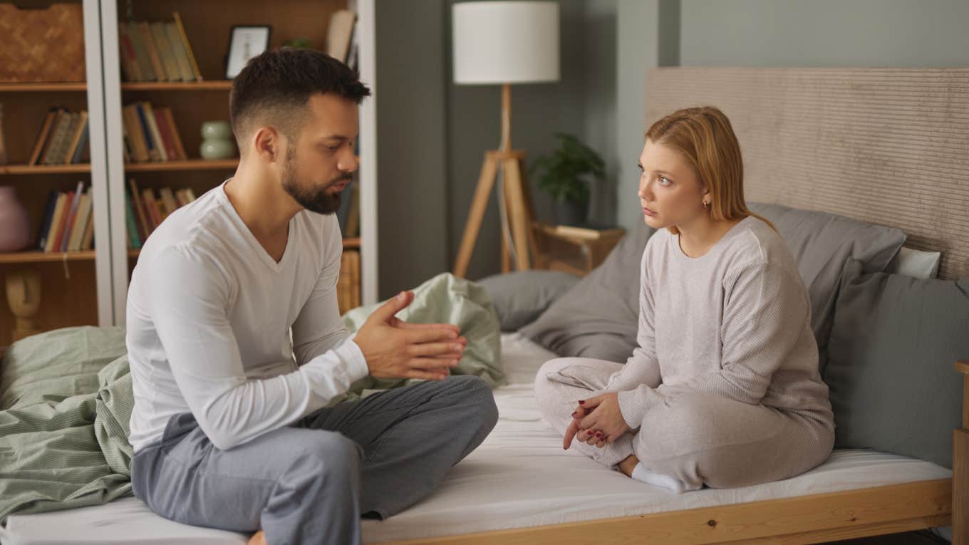 Husband Tells Wife To Become A Stay-At-Home Mom Despite Her Just Finishing Dental School unhappy couple arguing while sitting on bed
