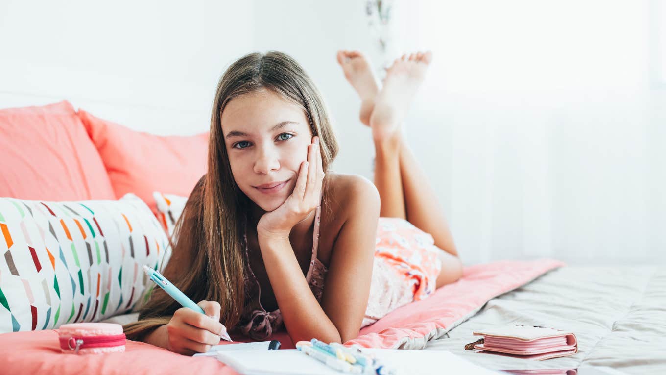 Mom Reveals Why She Feels Guilty Having Tween Kids During The Summer Tween girl sitting spending time alone in her bedroom