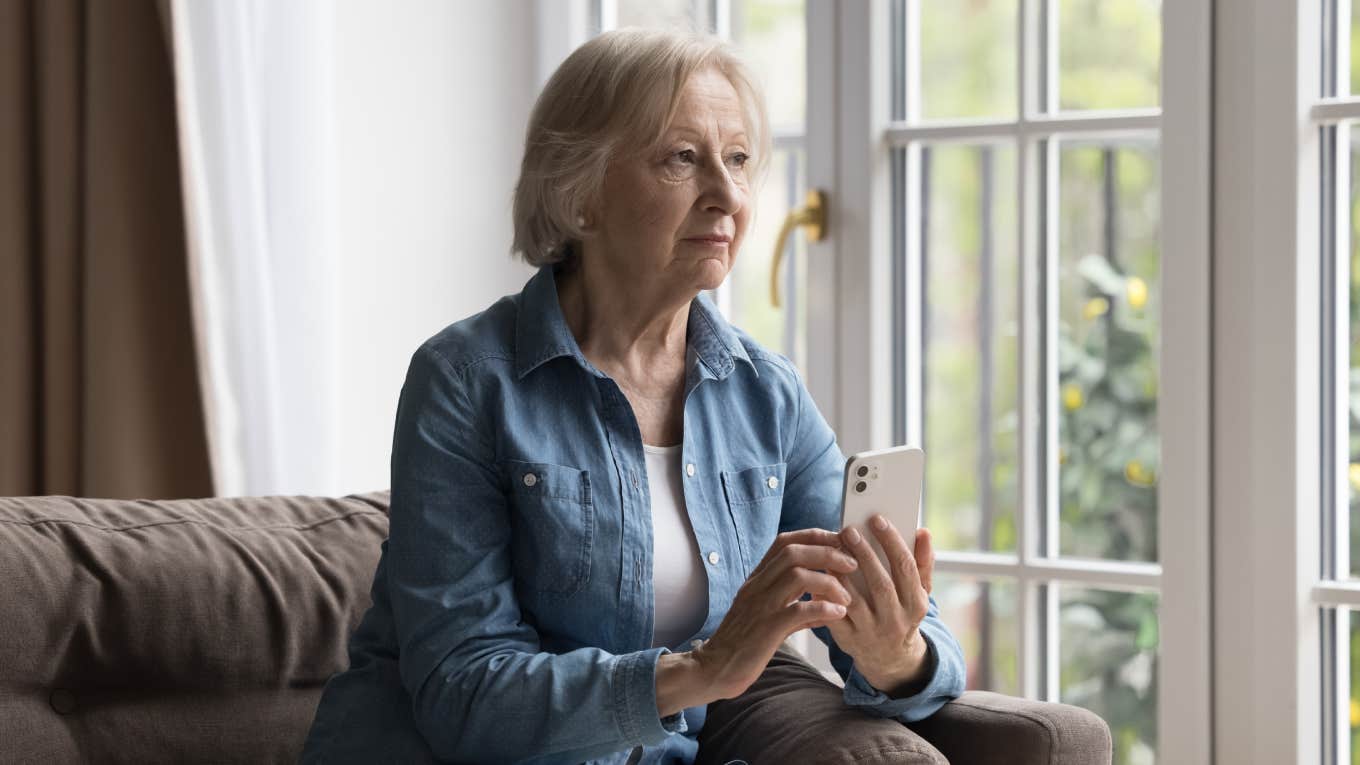Mother-In-Law Has Had Enough Of Her Son's Wife After She Sent Text About Overstepping Boundaries serious woman thinking while holding phone in her hands