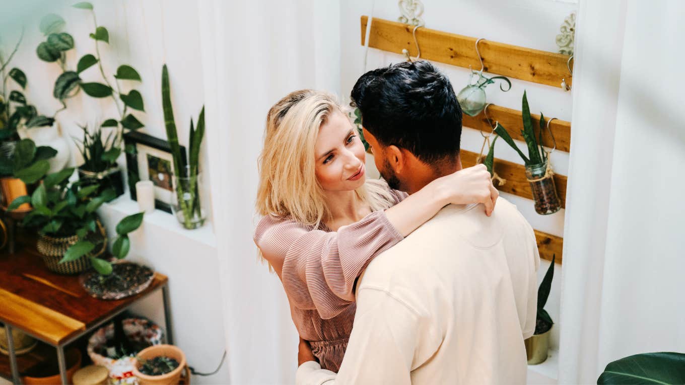 Powerful Ways To Create Intimacy With Literally Anyone, According To Psychology Couple creating a intimate connection with each other at home