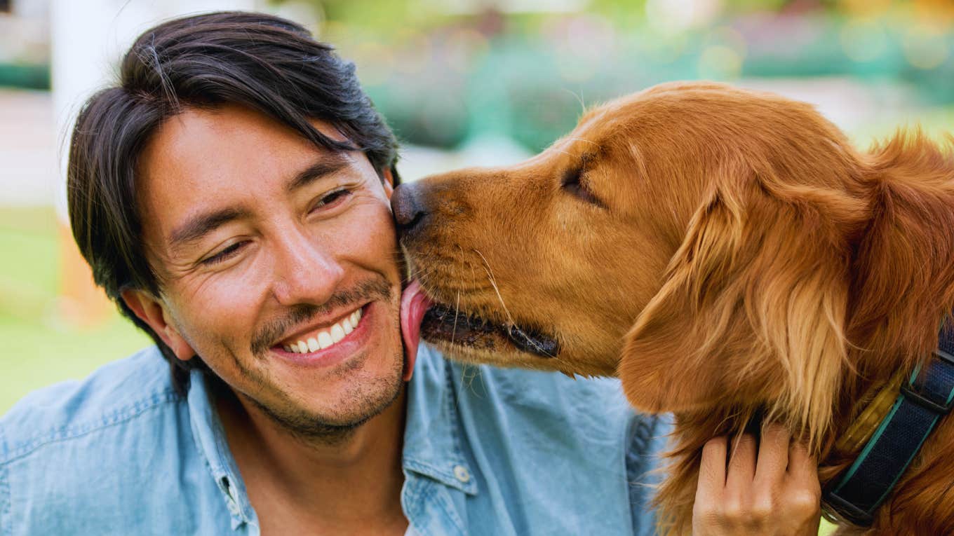 Subtle Signs He's Totally Smitten With You, According To Pyschology Man bonding with dog is smitten with a woman.