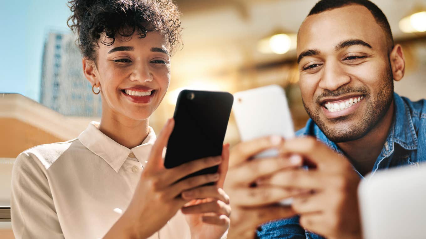 Signs Someone On A Dating App Actually Wants To Get Married Two people on dating app, smiling at phone