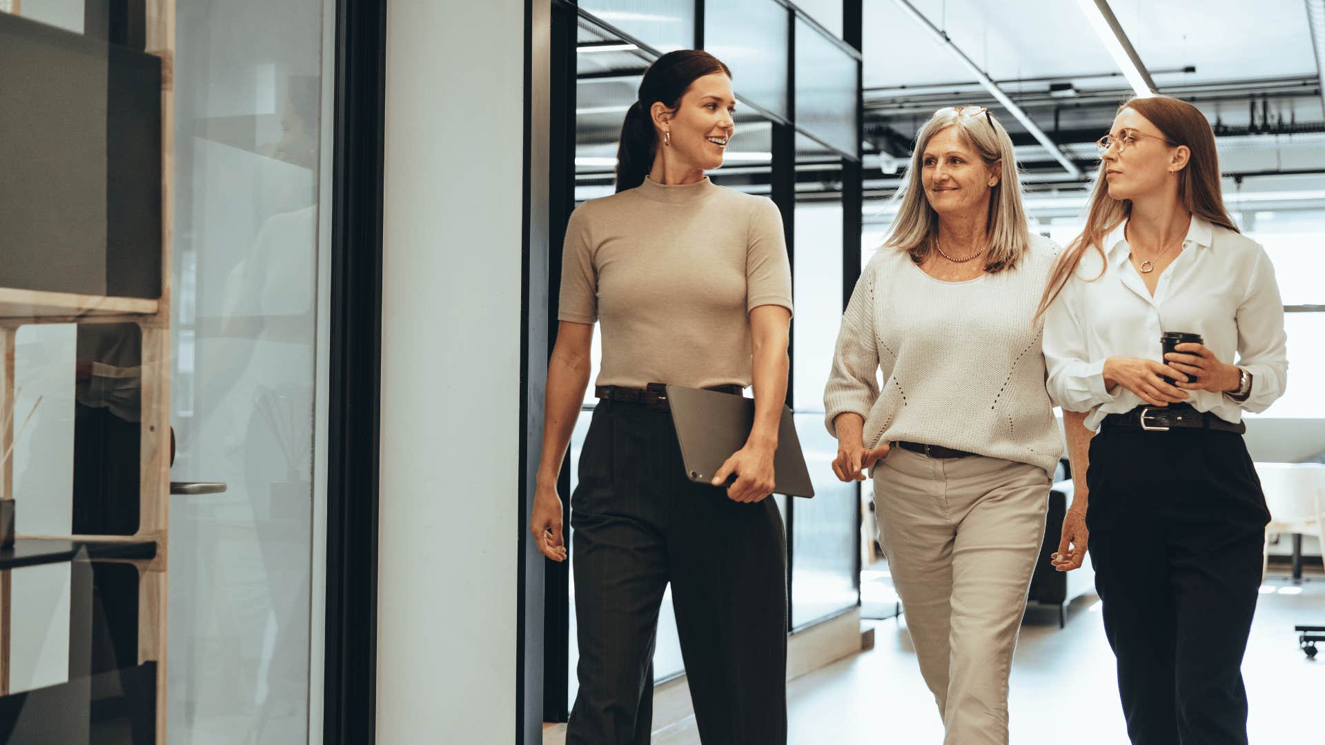 three female employees walking