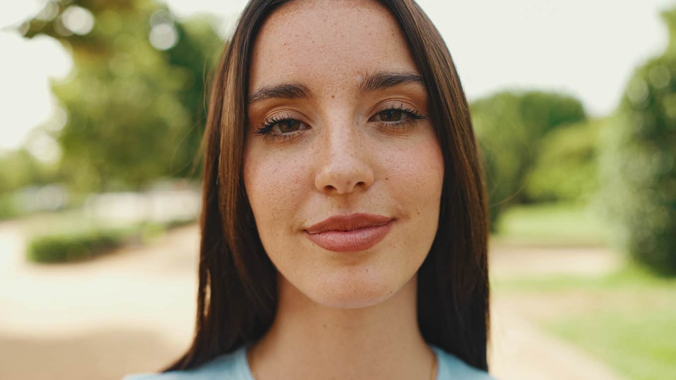 Signs Someone Is Not Nice, Even If They Pretend To Be young smiling woman