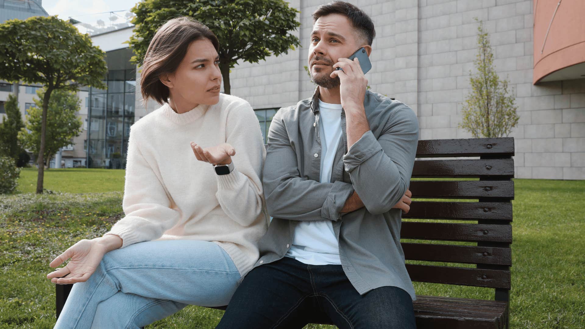 man ignoring woman while on phone