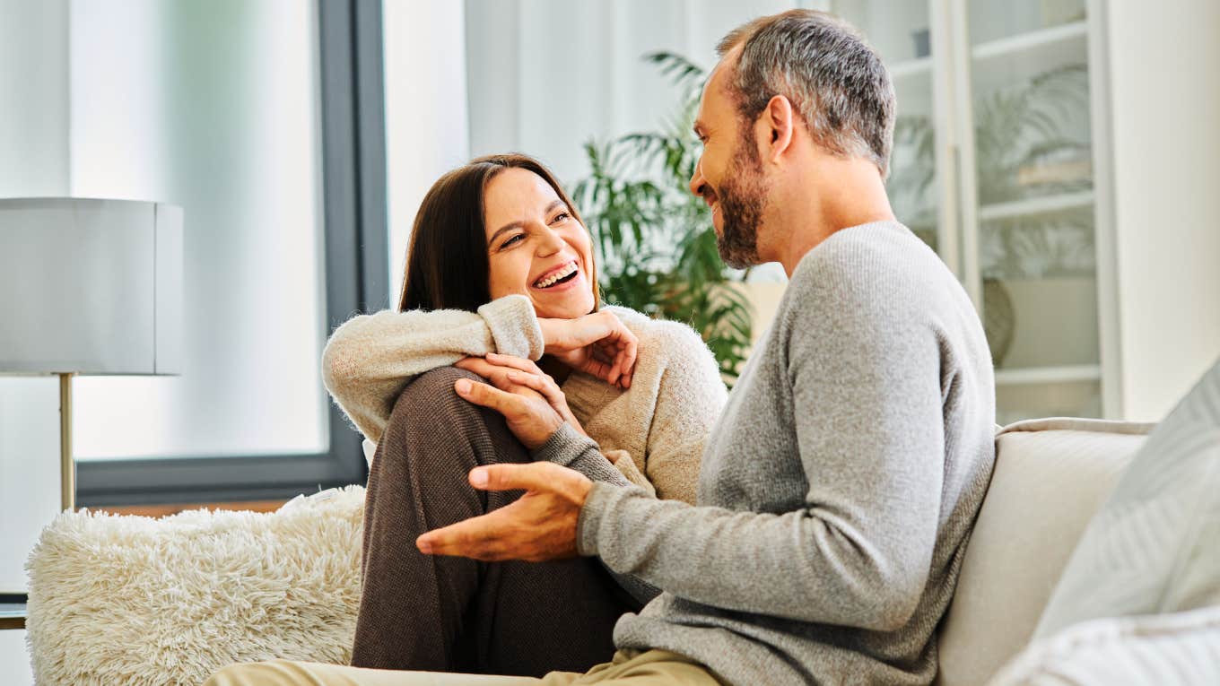 The Specific Way To Speak To A Man So He'll Actually Listen, According To Psychology Woman talking to a man in a way he actually listens
