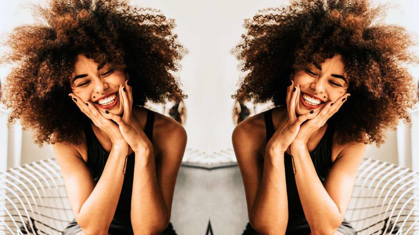 Subtle Behaviors That Instantly Magnetize People To You, According To Psychology Woman with magnetic happiness, smile