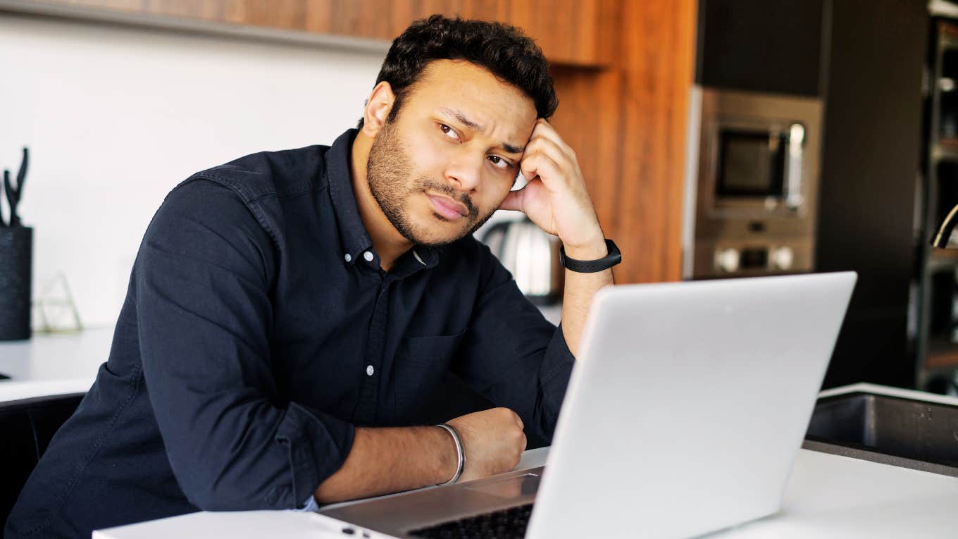 Subtle Signs You're About To Be Laid Off Man worried he may be laid off from work.
