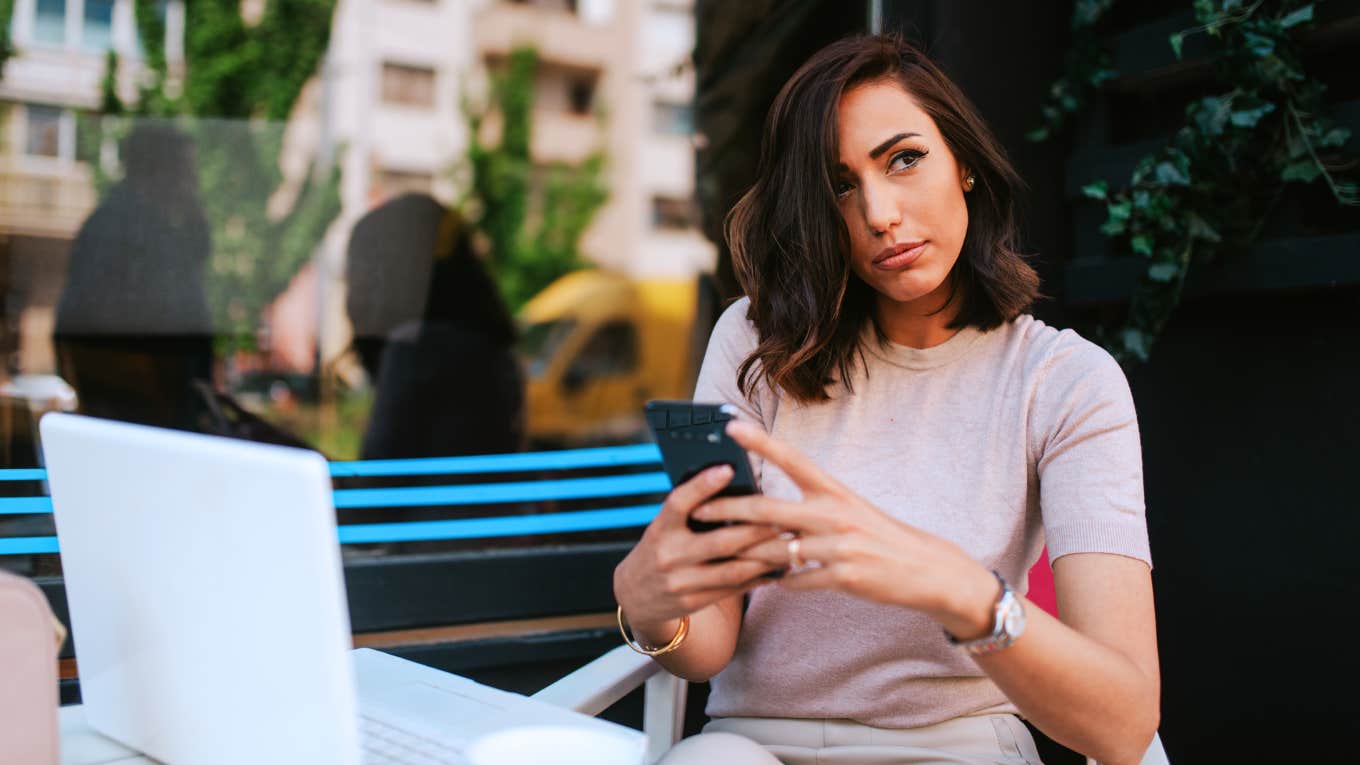 Texts To Never Send A Partner, No Matter How Angry You Are Angry woman deciding if she should text her partner