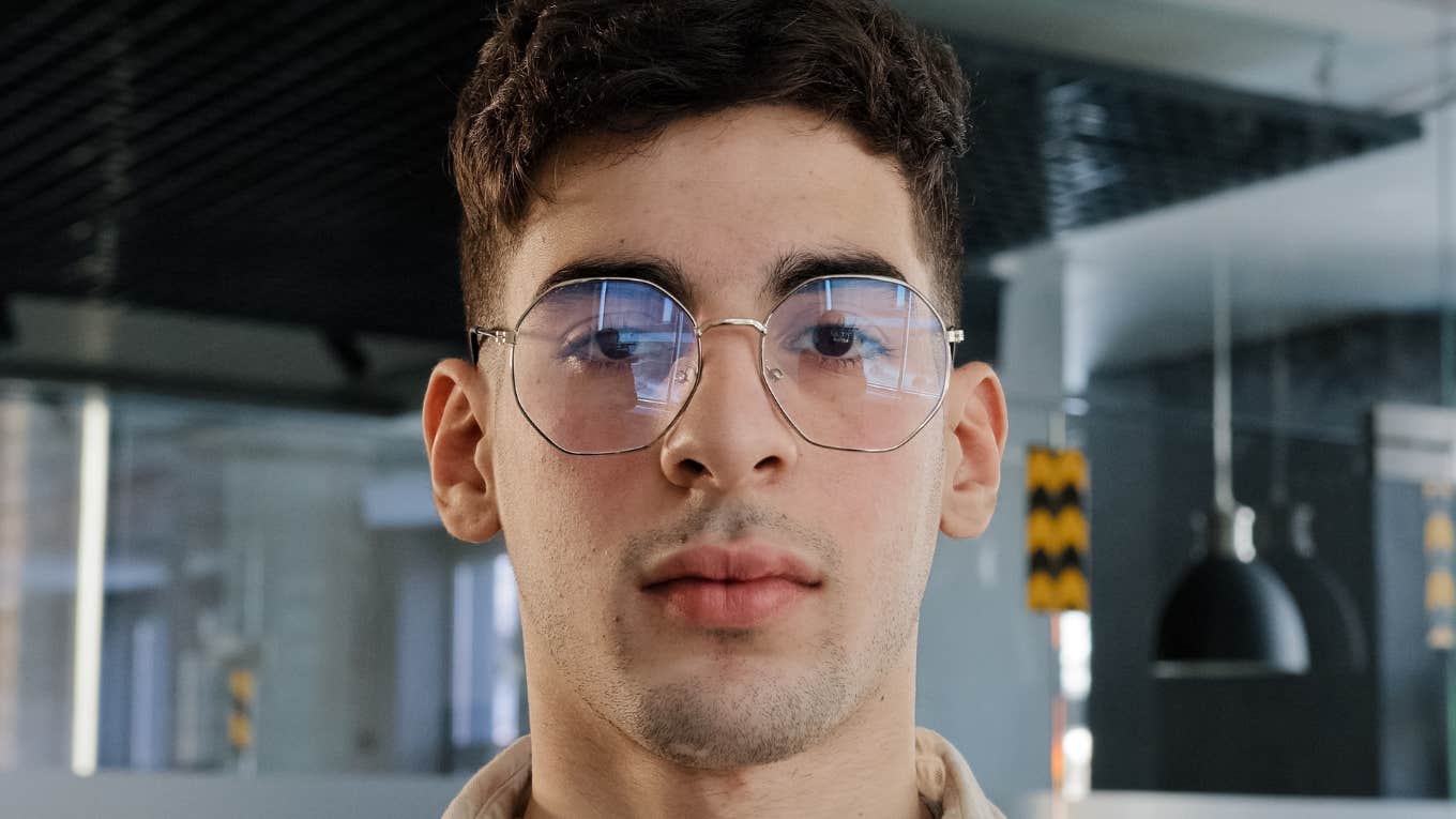 Subtle Traits Of People With Only A Few Friends serious man wearing glasses