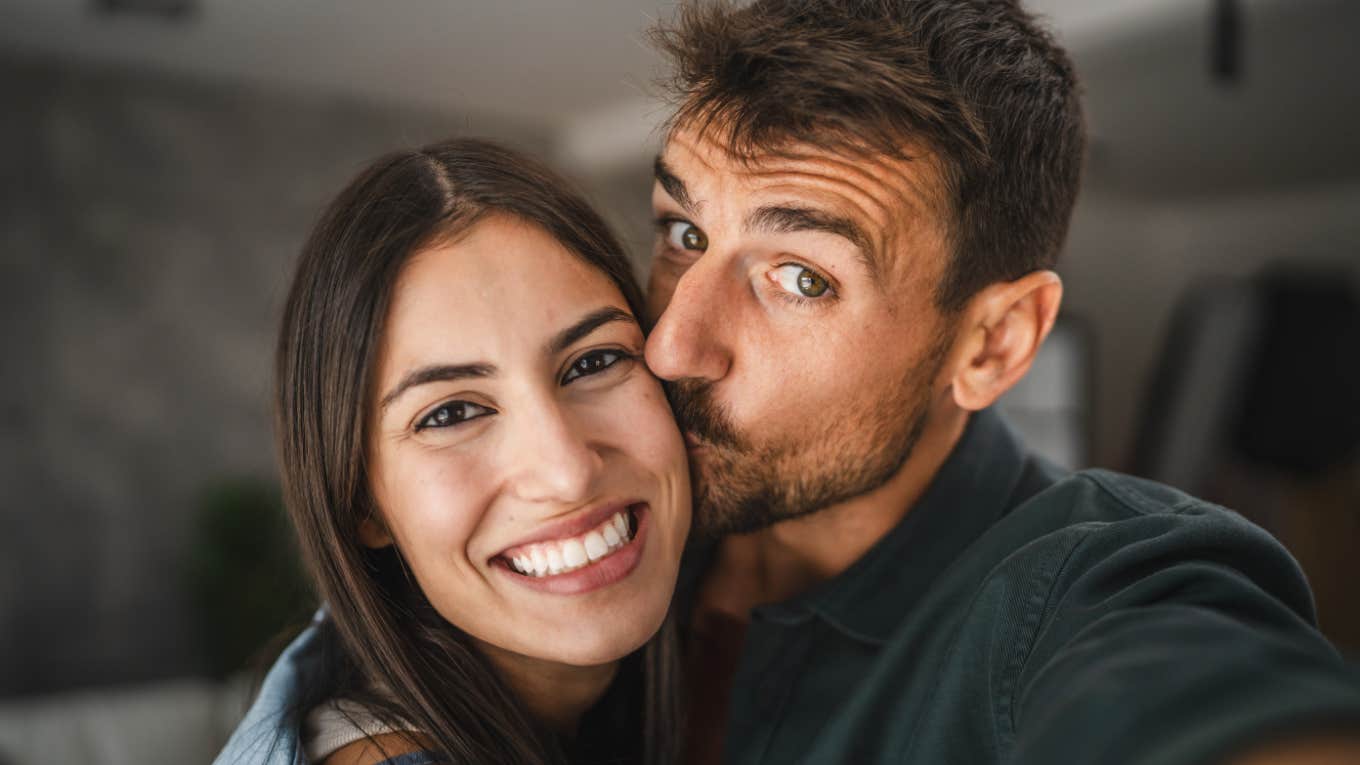 Traits Of A Truly Good Husband, According To Psychology man kissing woman's cheek lovingly