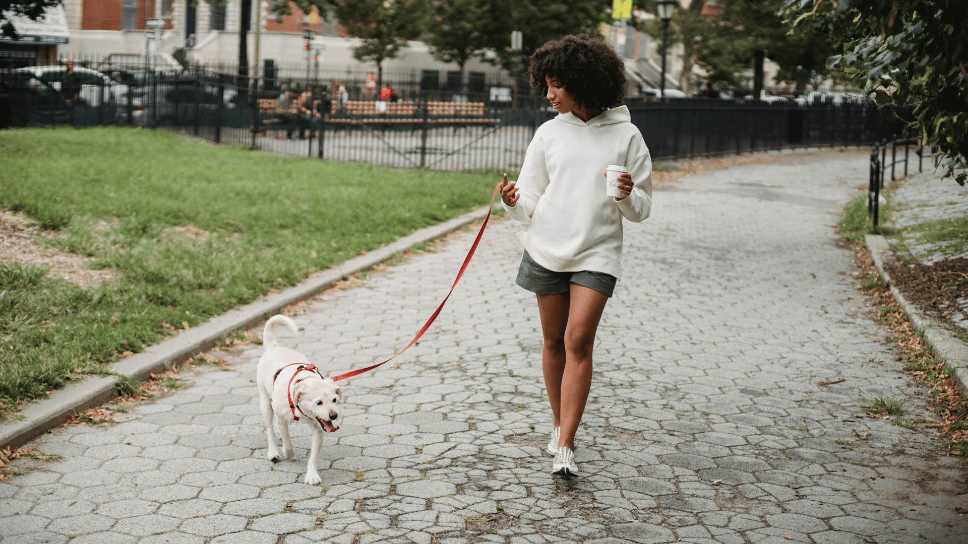 young woman walking down a path