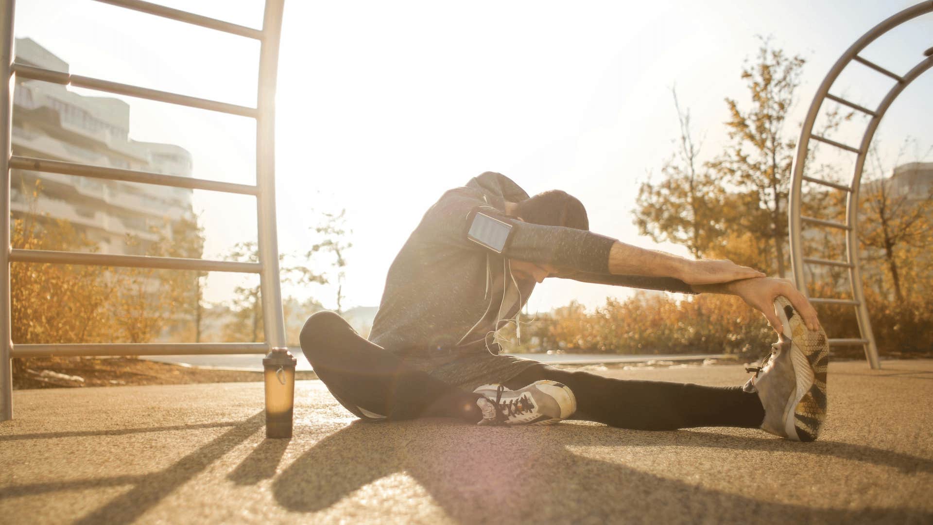 man stretching outdoors