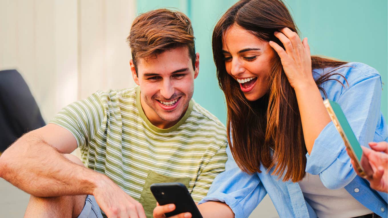 Only 67% Of People Can Hear This Silent GIF couple looking at their phones to see if they can hear the silent gif