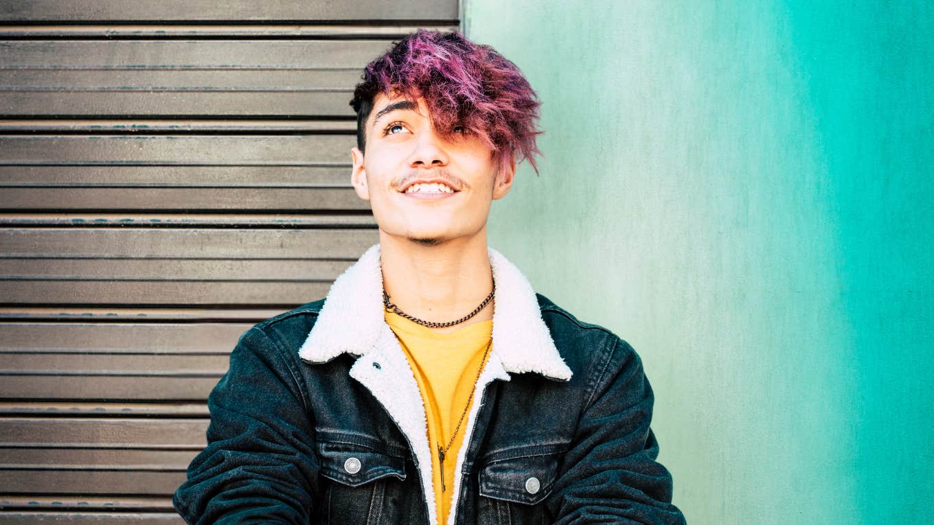 The reasons your partner's love never feels like enough Young man with purple hair learning how to let partner's love feel like enough