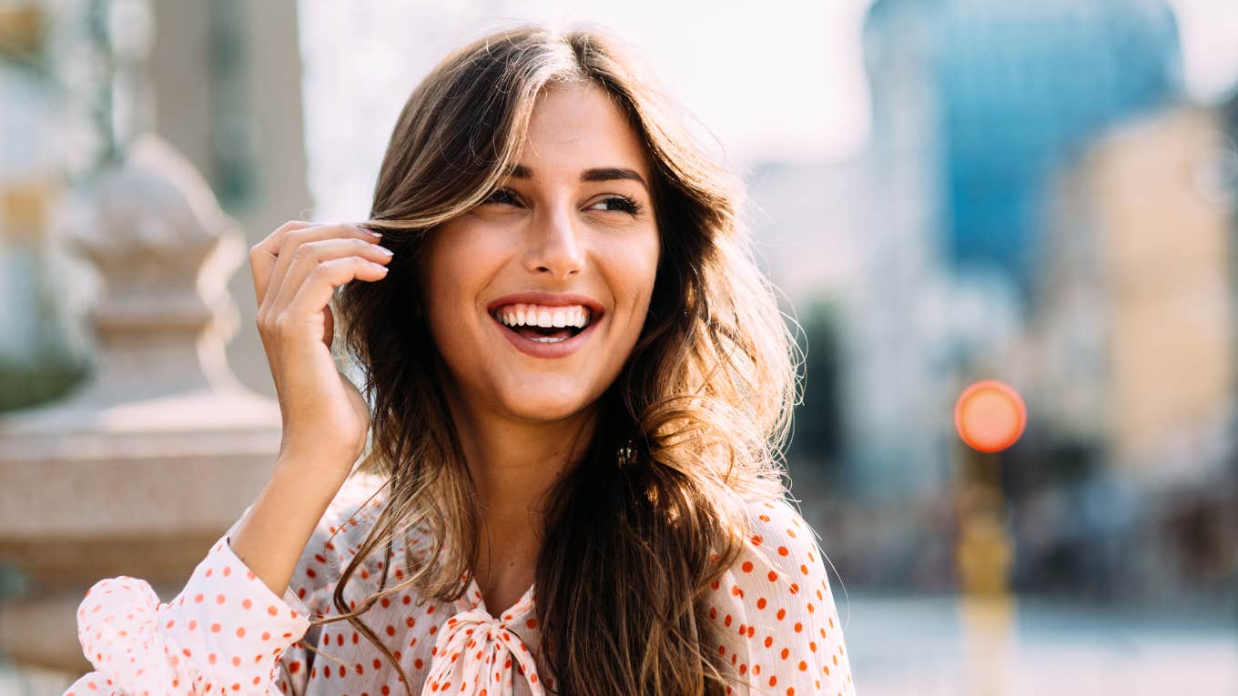 Common Habits of Happy People Who've Overcome The Worst Types Of Heartbreak Happy woman overcoming heartbreak.