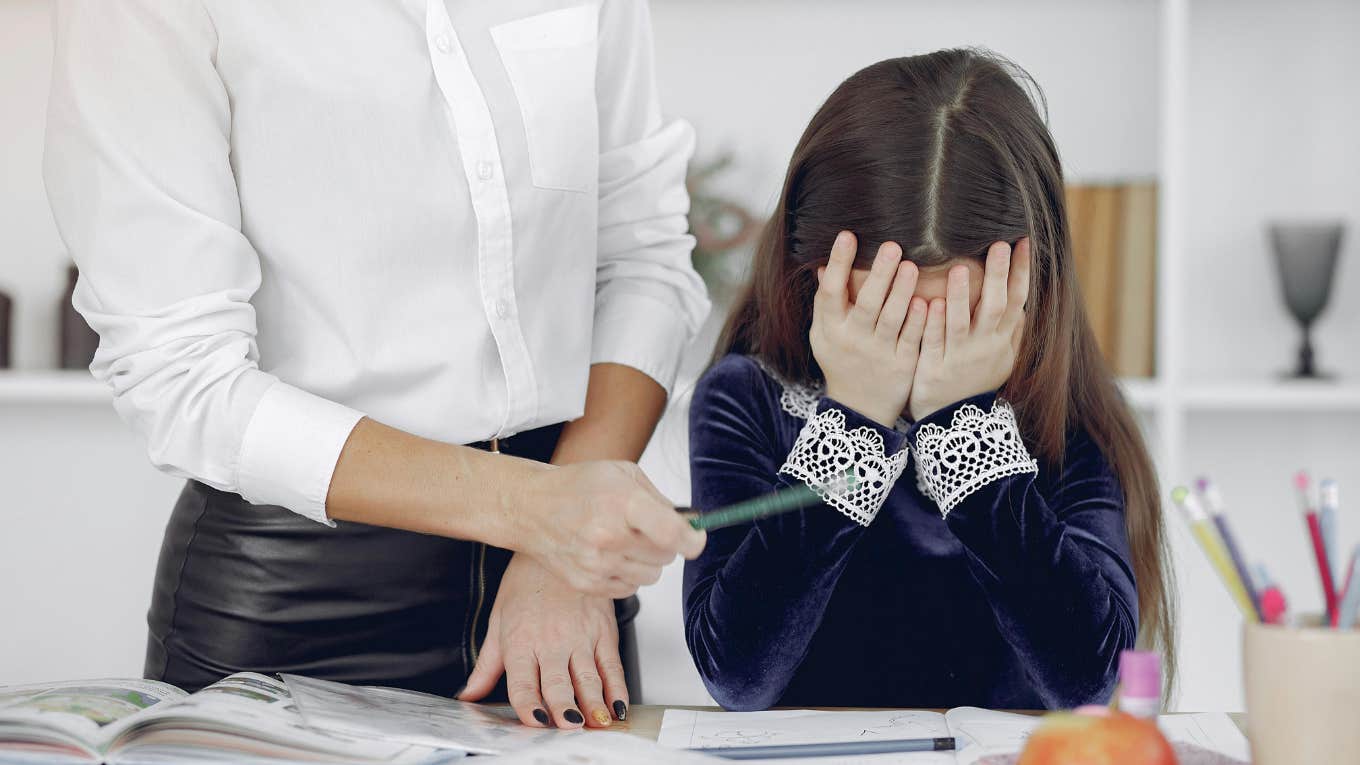 Former Teacher Says ‘Too Much Empathy’ Is Why Students Are Failing and Teachers Are Quitting Student failing with head in hands