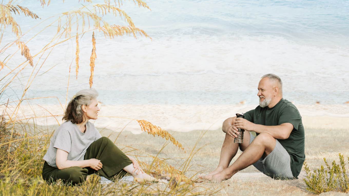 Coming Full Circle In My Marriage Mature couple, sitting on the beach together.