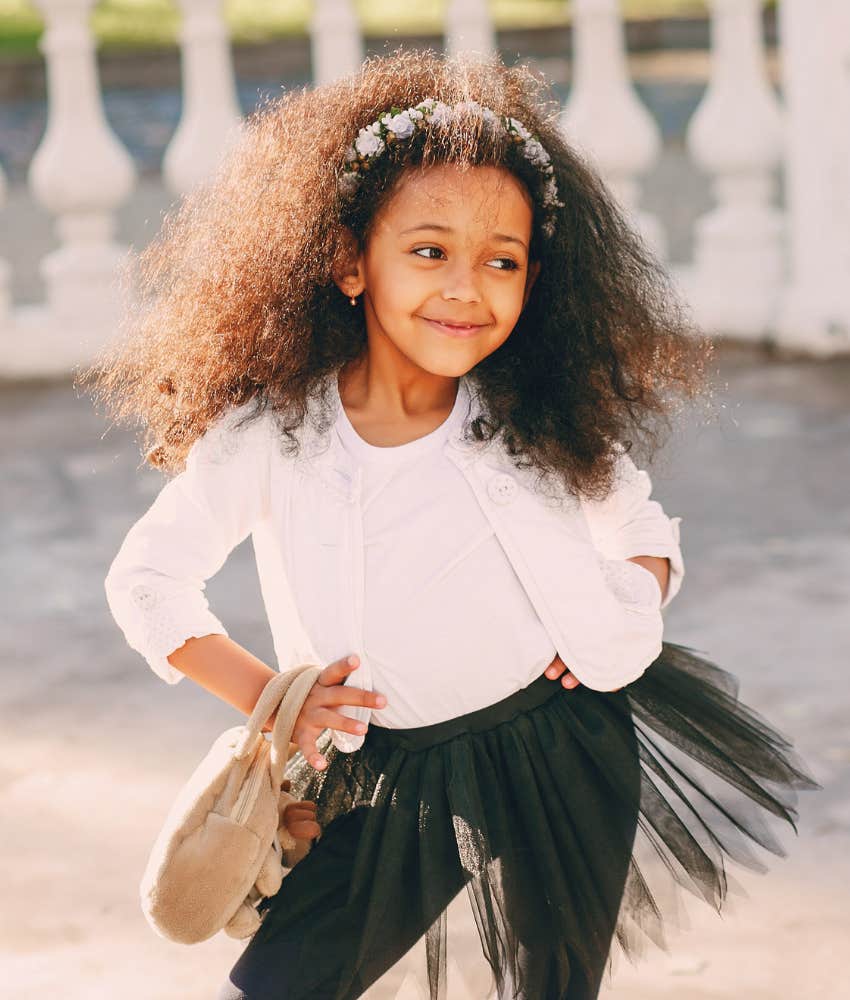 Beautiful and happy little girl with natural hair