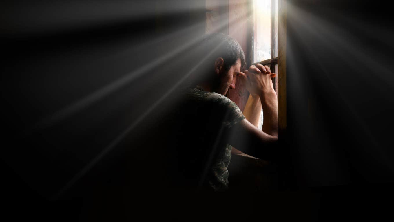Impact Plastics Workers Speak Out About Allegedly Being Forced To Work Through Hurricane Helene distraught man looking though window in dark room working though hurricane helene