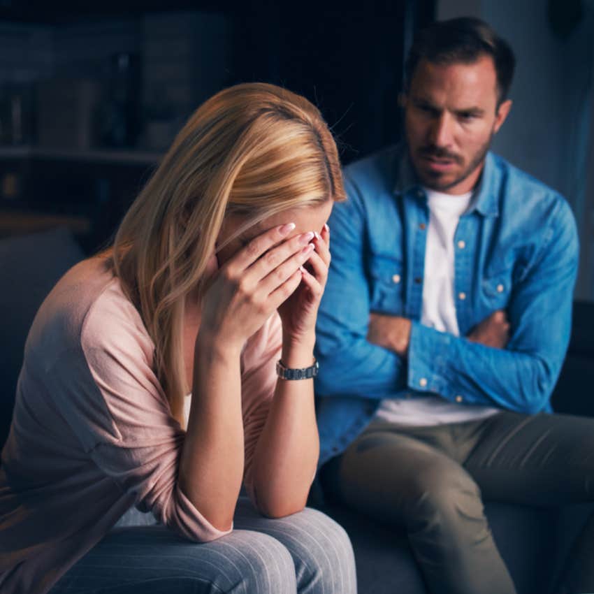 man looking at woman crying 