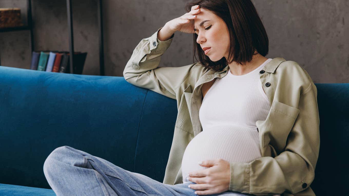 Pregnant Worker Quits On The Spot When She's Reprimanded For Sitting Down While Taking Orders Sad pregnant woman after quitting her job