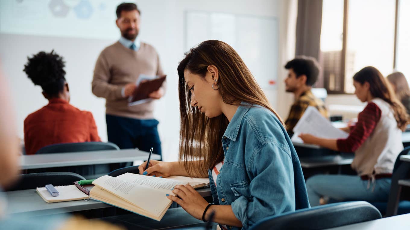 Professors From Elite Colleges Admitted Students From Public Schools Don't Know How To Read Books University student writing in her notebook while attending a lecture in the classroom.