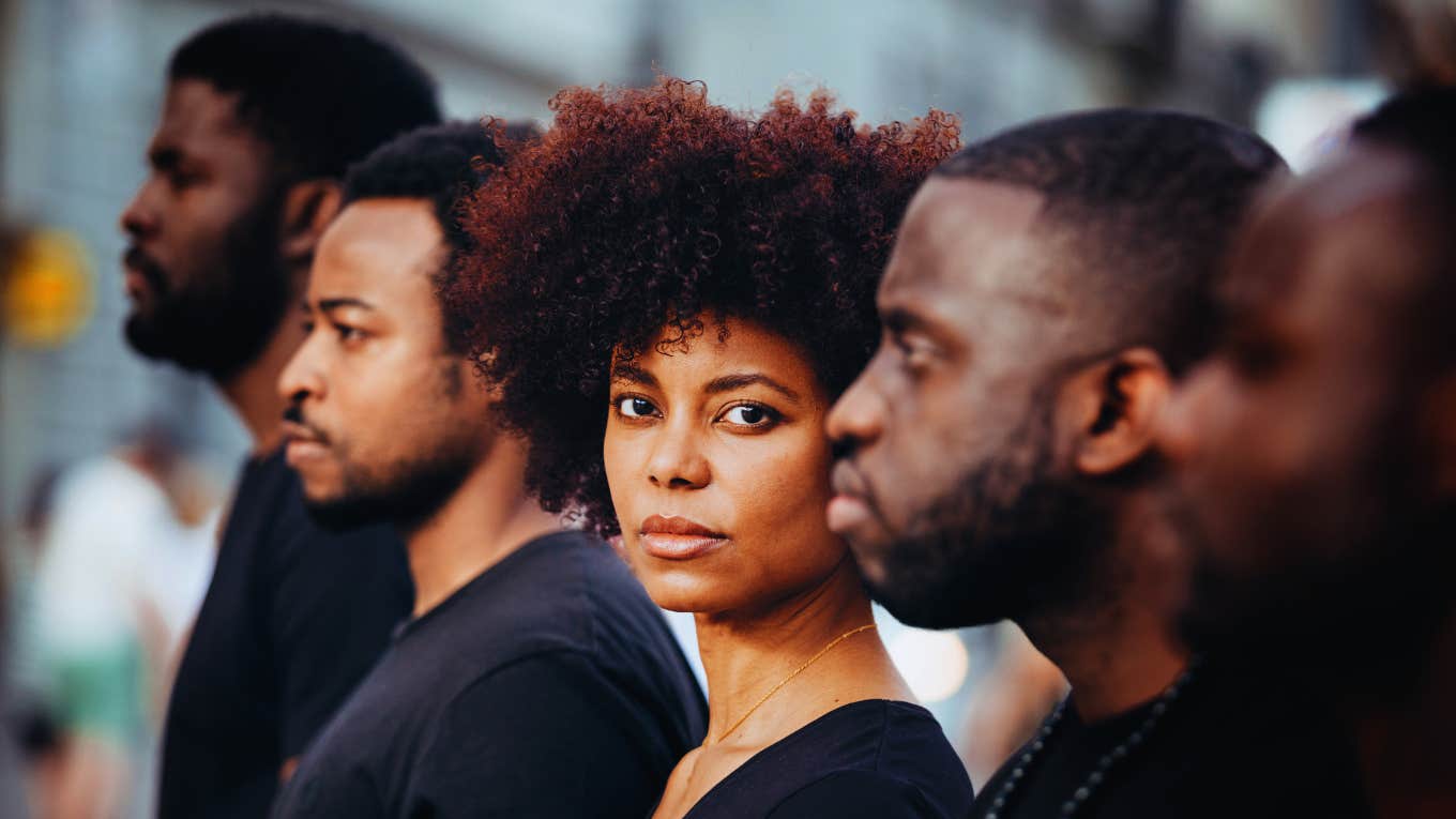 The Secret To Attracting Any Man Comes Down To One Thing Woman standing out, attracting man.