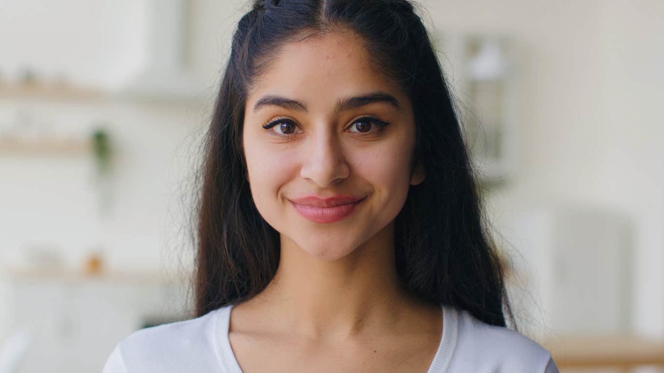 Signs Of A Genuinely Kind Person That Can't Be Faked kind young woman smiling