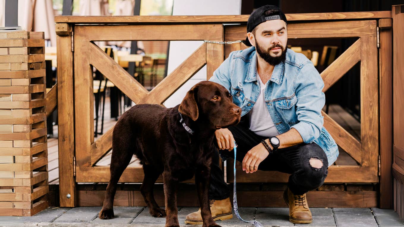 Small Behavior Shifts That Will Give You An Unfair Mental Edge Man changing his typical behavior, and taking a walk in the morning with his dog.